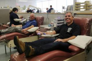 Suffolk County Executive Steve Bellone, right, and Comptroller Joseph Kennedy donated blood Jan 28 at a blood donation center in Bohemia. 